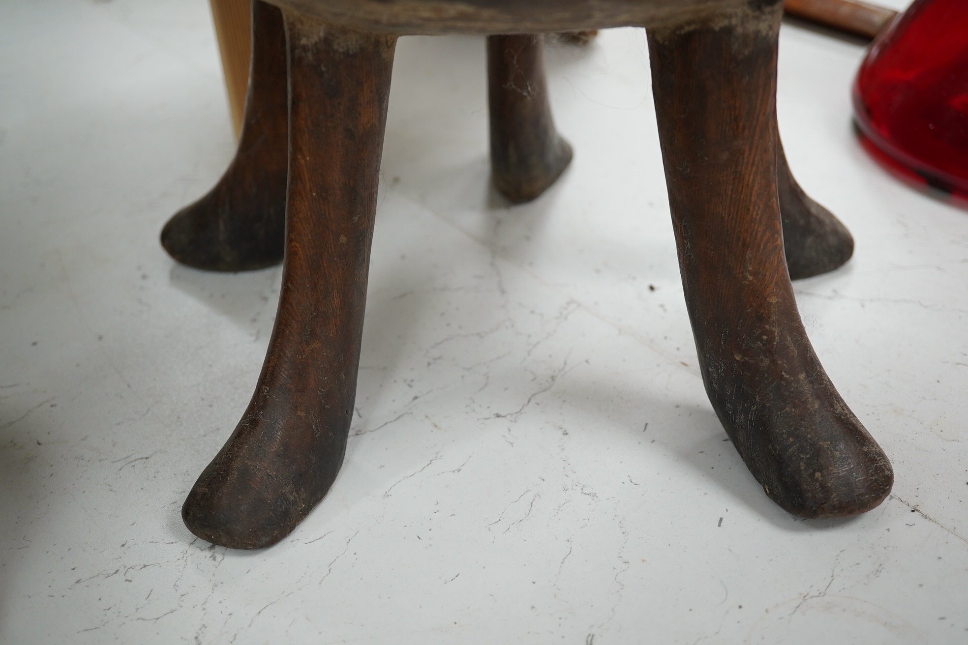 An African five-legged wooden bowl, 21cm high. Condition - fair